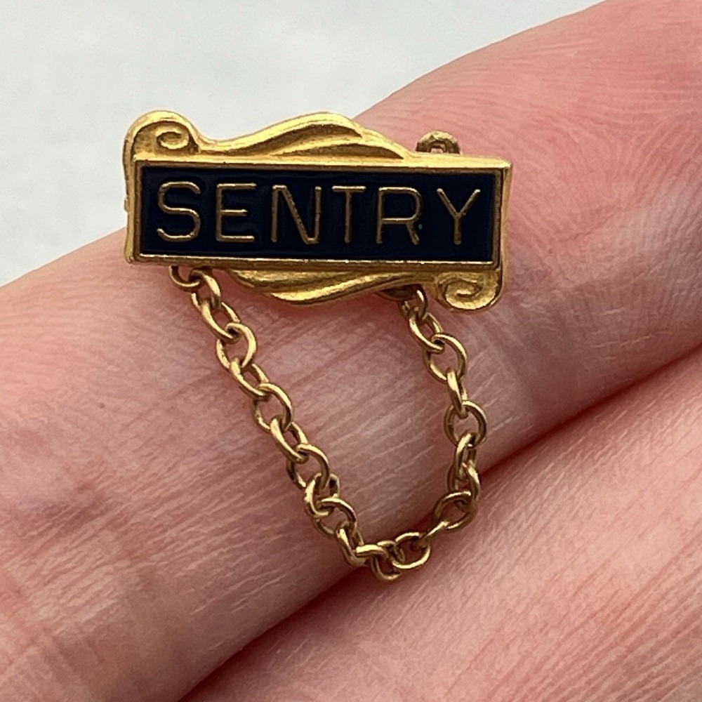 Vintage Sentry Insurance Gold Tone Black Enamel Lapel Pin Tie Tack Safety Chain